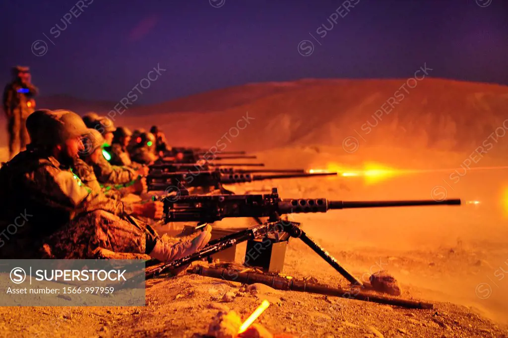 KABUL - Afghan National Army recruits fire the 50 cal  Heavy Machine Gun during a night exercise held at the Infantry Branch School, Camp Julien, 19 J...