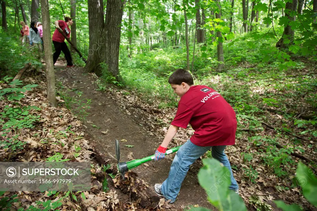 Ann Arbor, Michigan - Volunteers rebuild a section of a hiking trail in Black Pond Woods  The volunteers were recruited through Recreational Equipment...