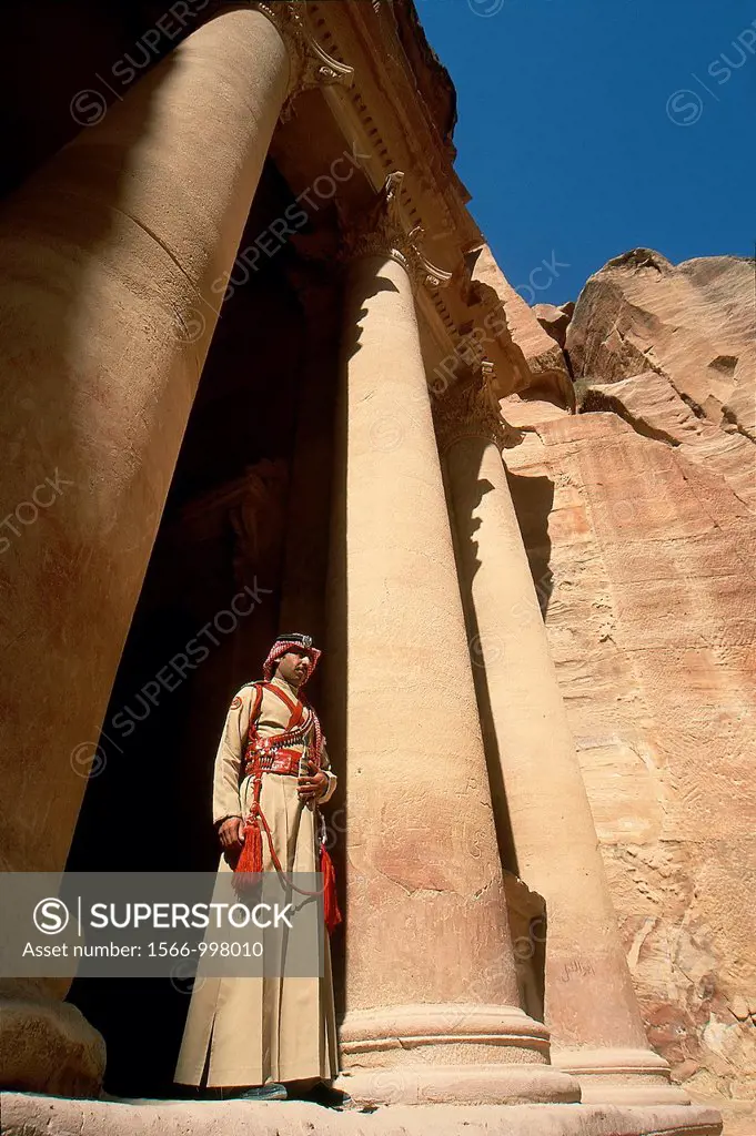 guard in costume of Al Khazneh or The Treasury, one of the most elaborate buildings of the ancient city of Petra, Jordan, Middle East, Asia