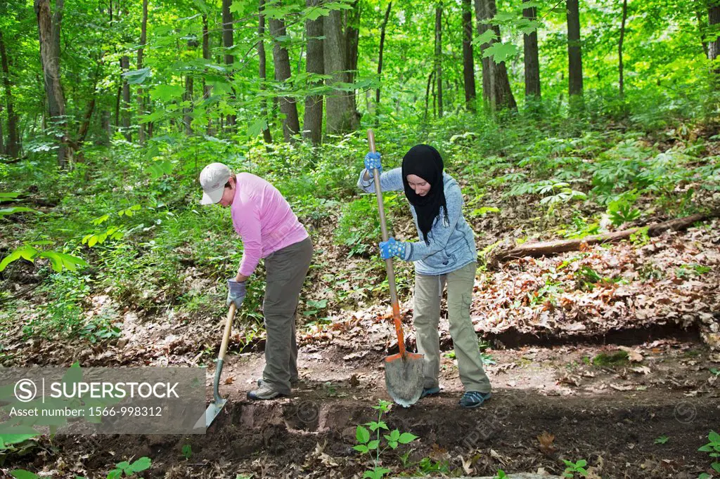 Ann Arbor, Michigan - Volunteers rebuild a section of a hiking trail in Black Pond Woods  The volunteers were recruited through Recreational Equipment...