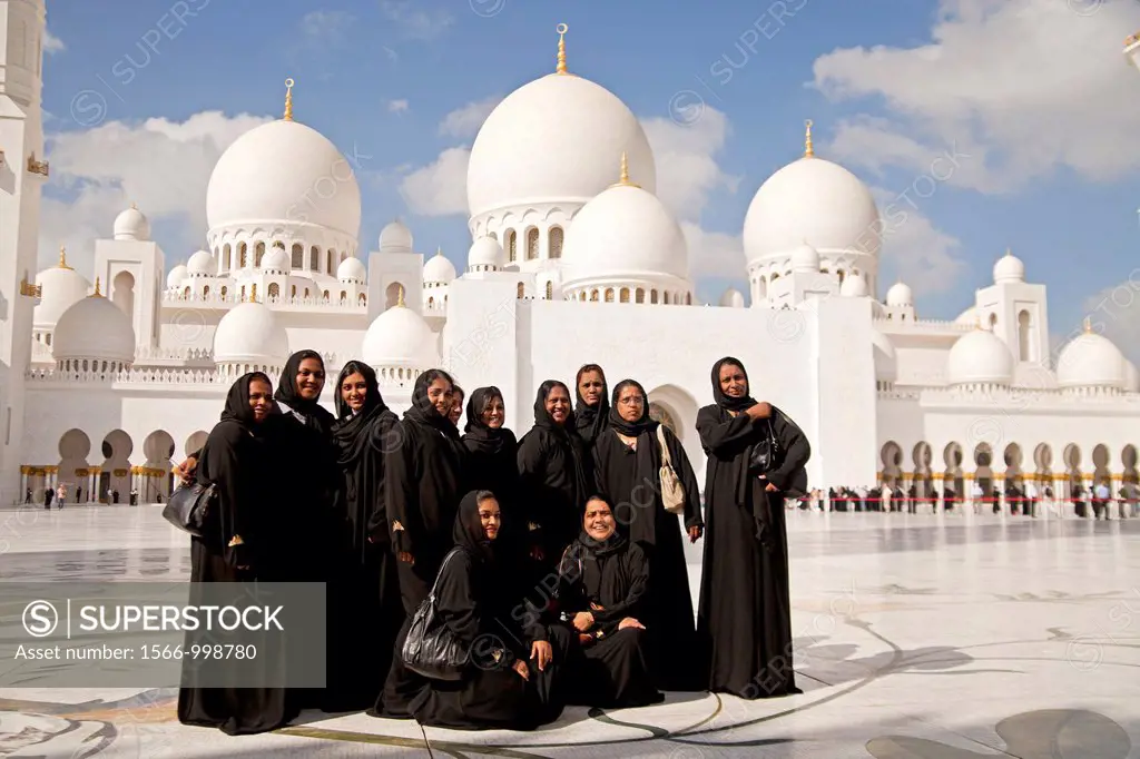 group of black veiled woman posing in front of the Sheikh Zayed Grand Mosque in Abu Dhabi, capital city of the United Arab Emirates UAE, Asia