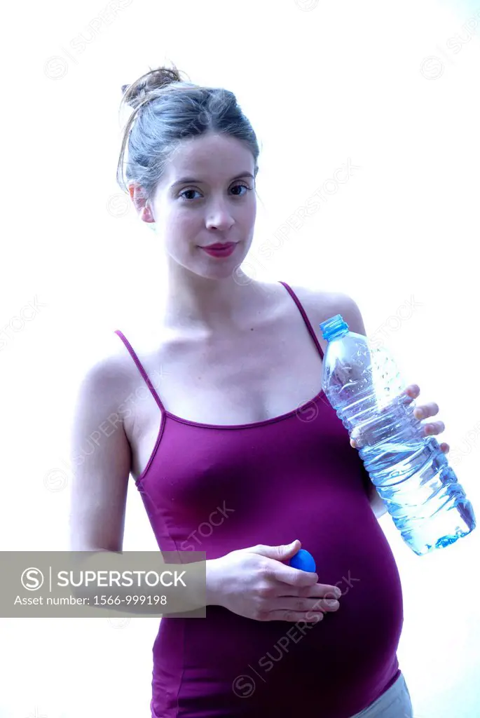 Pregnant woman at full term drinking water
