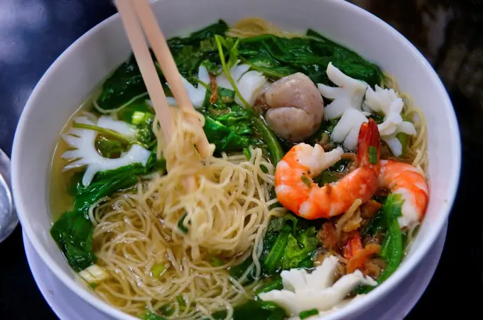 Vietnam. Hanoi. Food: noodles soup with vegetables, shrimps and squids.