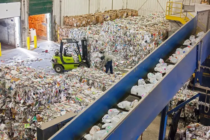 Troy, Michigan - Low-wage workers sort paper, glass, plastic, and metals for recycling at the Southeastern Oakland County Resource Recovery Authority....