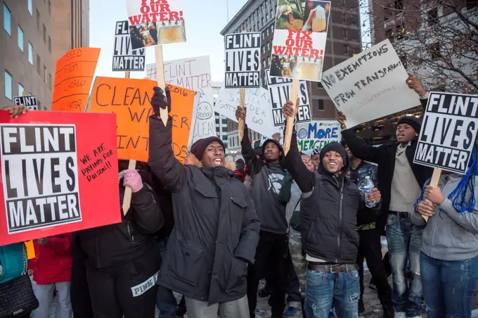 Lansing, Michigan - Labor and community activists picket Governor Rick Snyder´s annual State of the State speech, calling for him to resign because of...