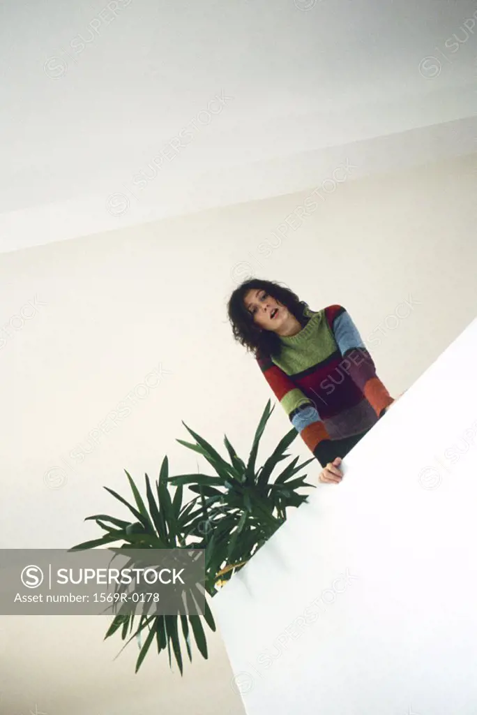 Woman looking down from mezzanine