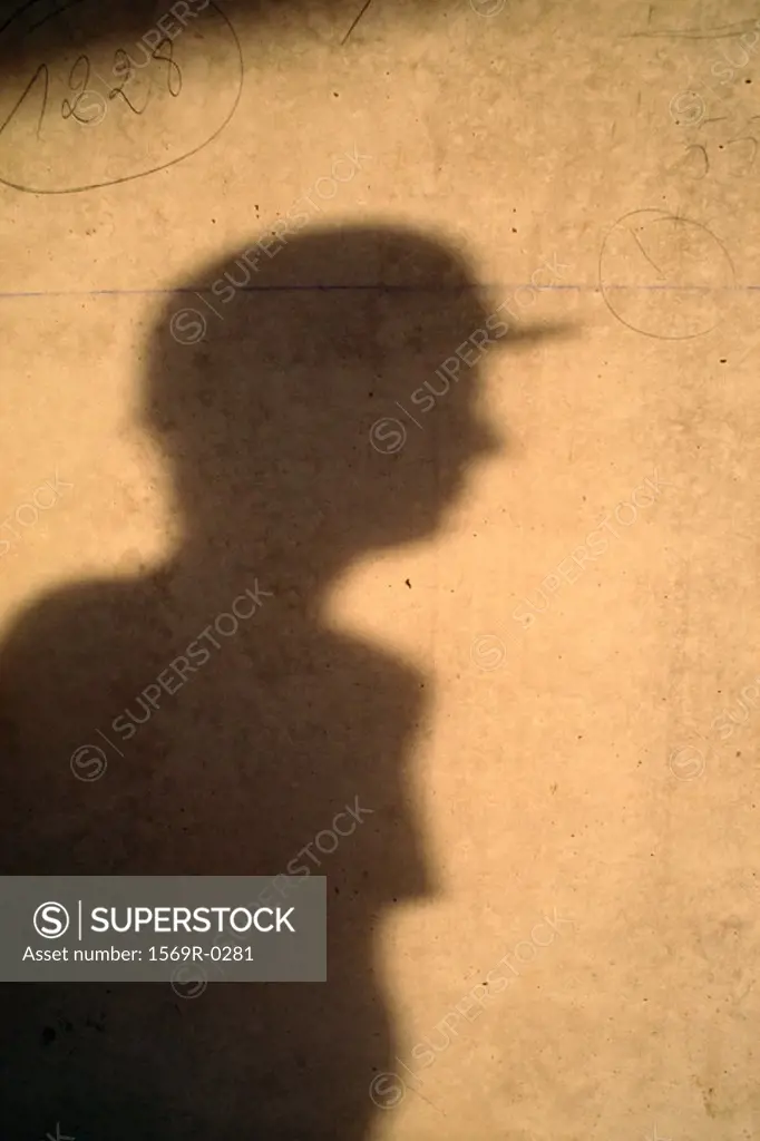 Shadow of person in hard hat