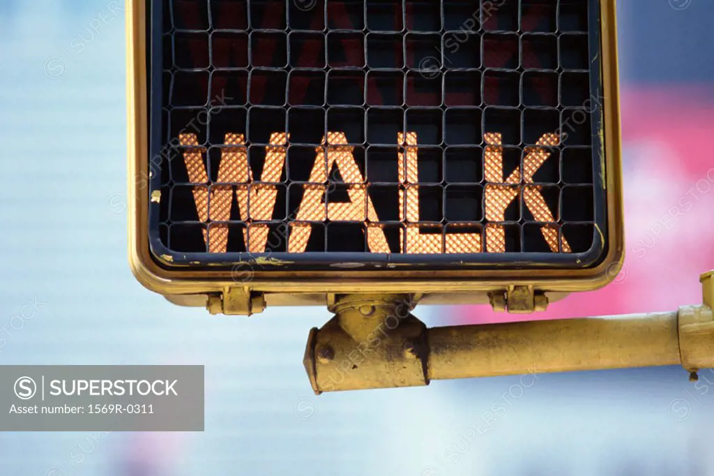 Lit pedestrian walk sign, close-up