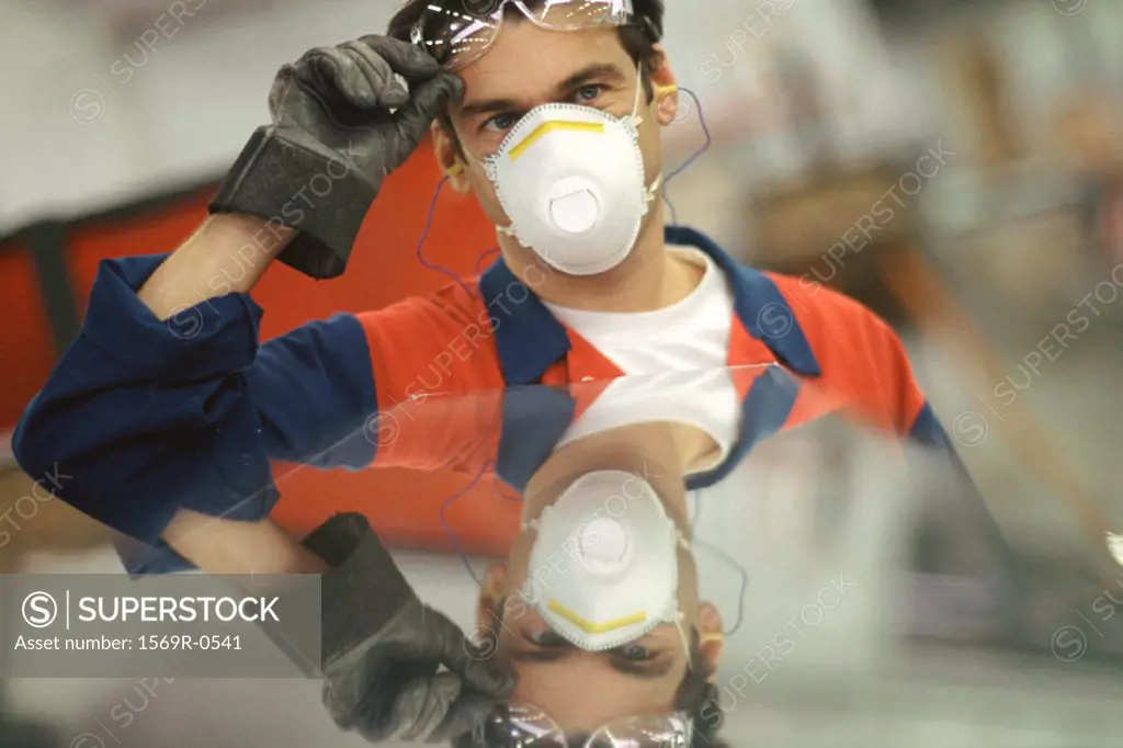 Manual worker wearing protective gear