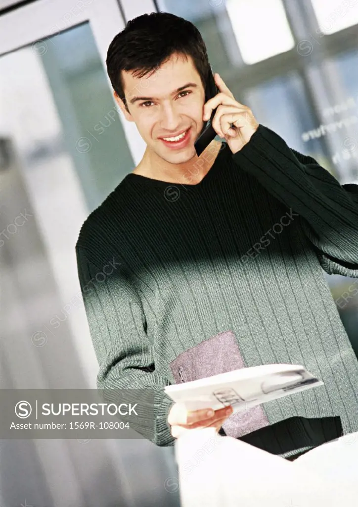 Man using cell phone, portrait