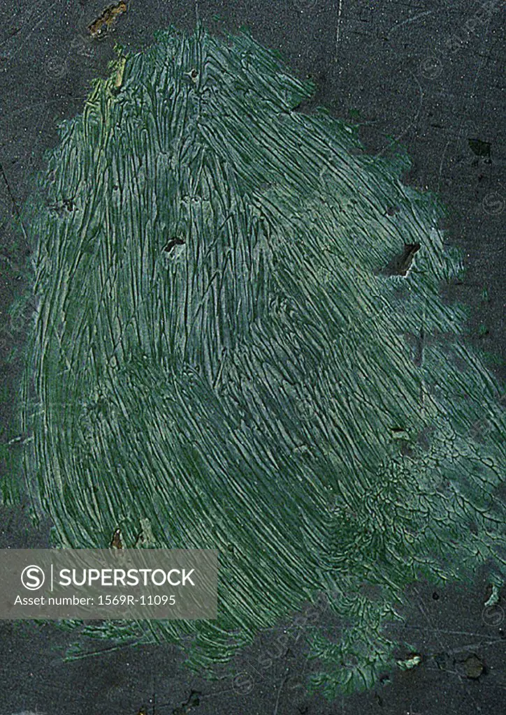 Scratched greenish paint, close-up