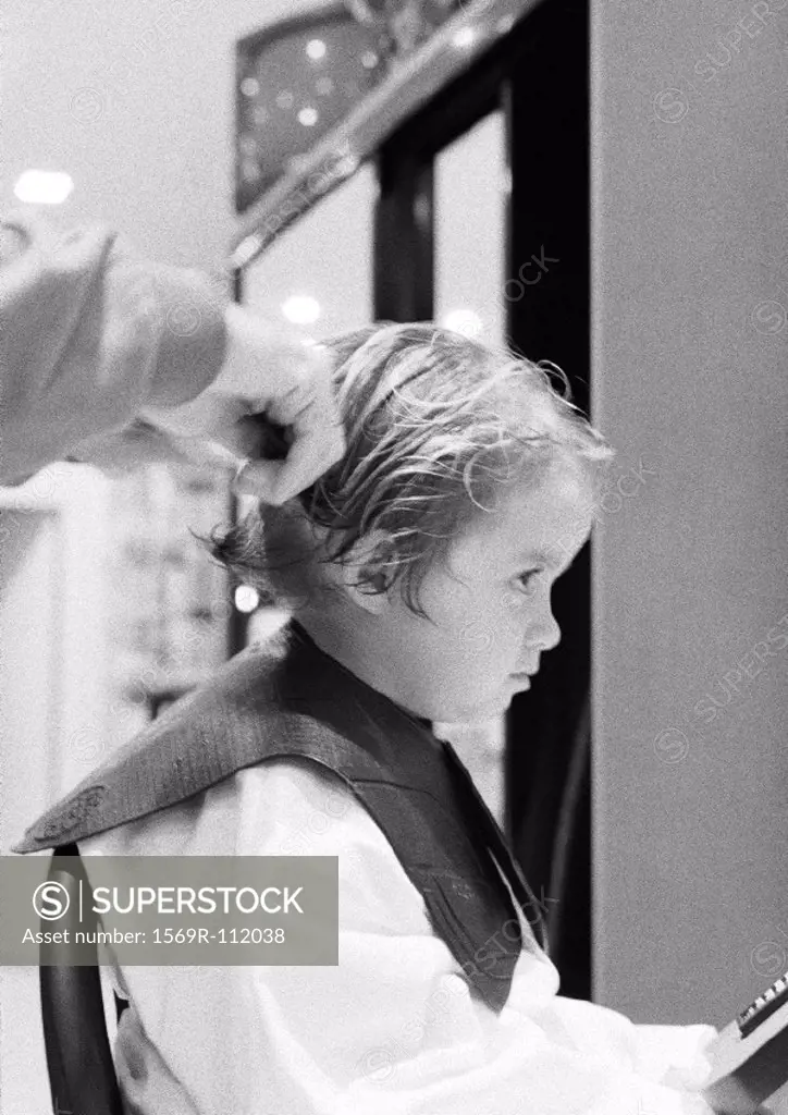 Girl at hairdresser, side view, b&w