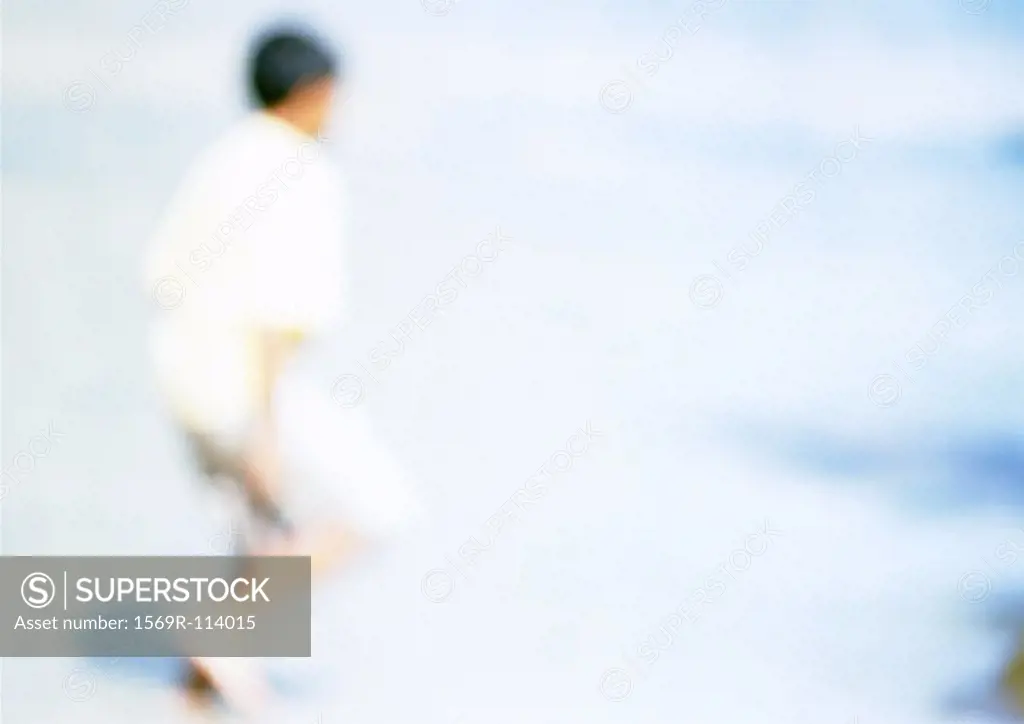 Person on beach, blurred