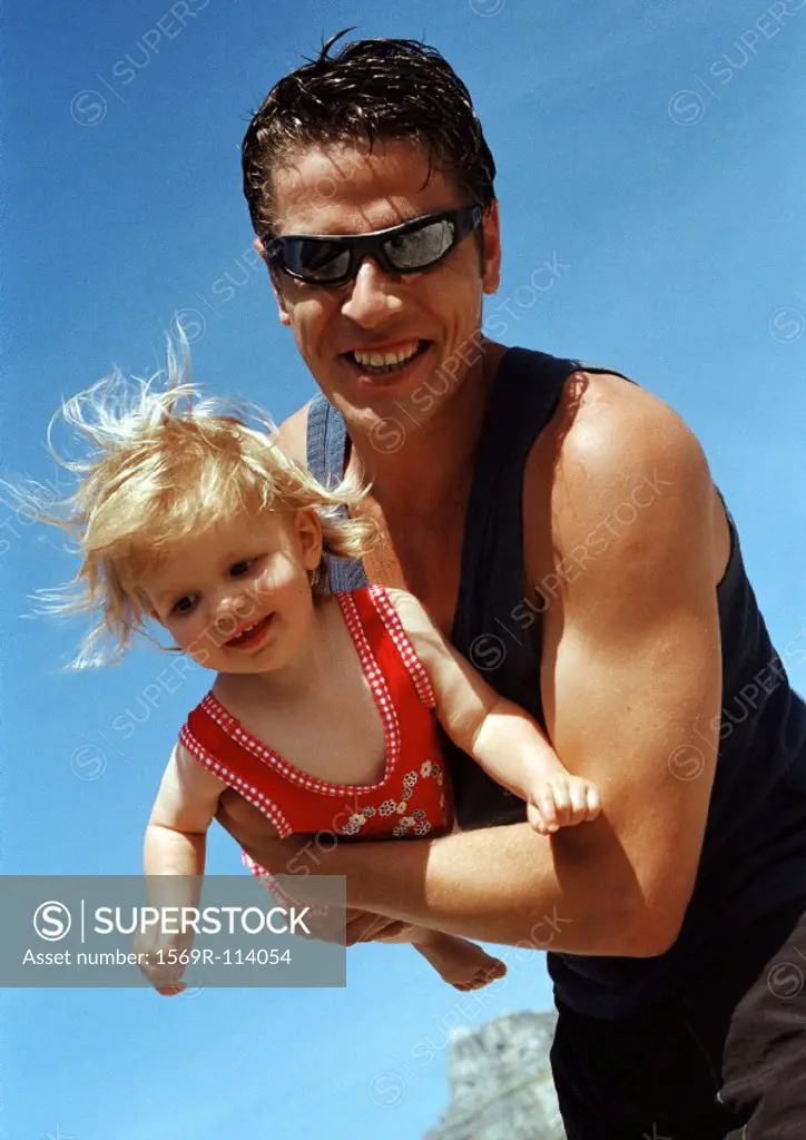 Man holding little girl, close-up