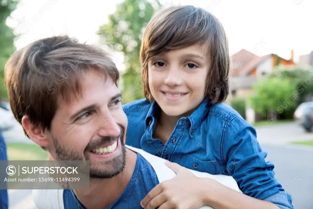 Father and son together outdoors, portrait