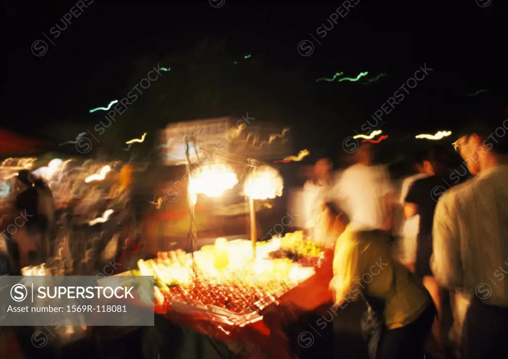 Fruit stall in street at night