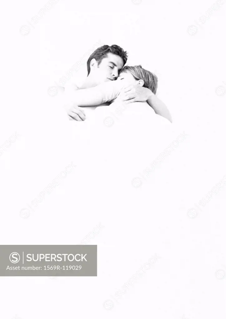 Couple lying in each other´s arms, b&w