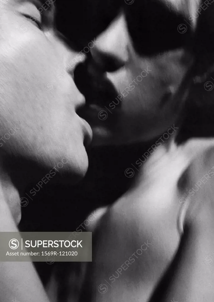 Nude couple kissing, close-up, b&w
