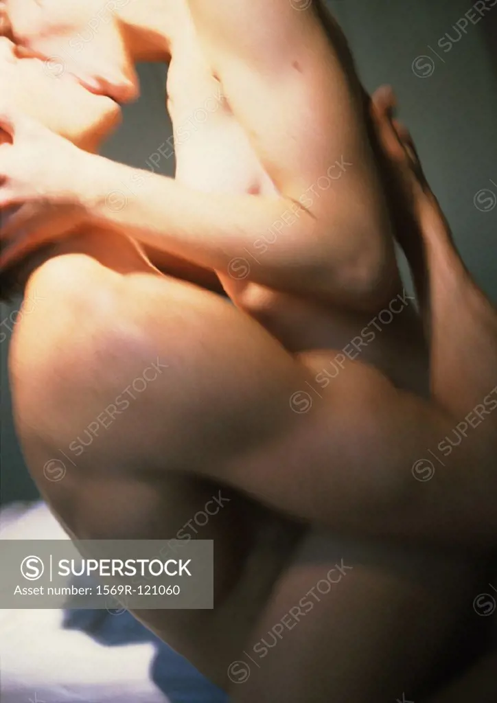 Nude couple making love, side view, close-up