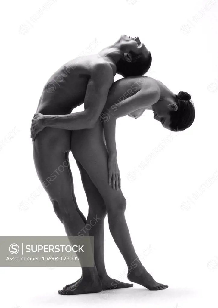 Nude man and woman back to back, woman bending forward, man bending backwards, b&w