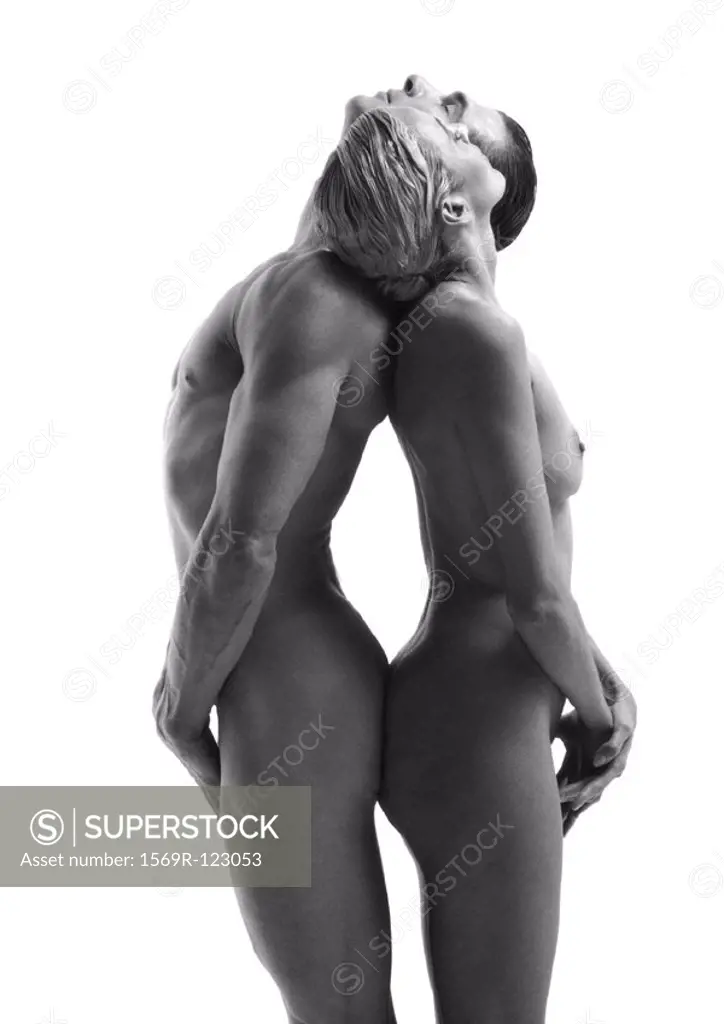Nude man and woman standing back to back, leaning head back on each others shoulders, side view, b&w