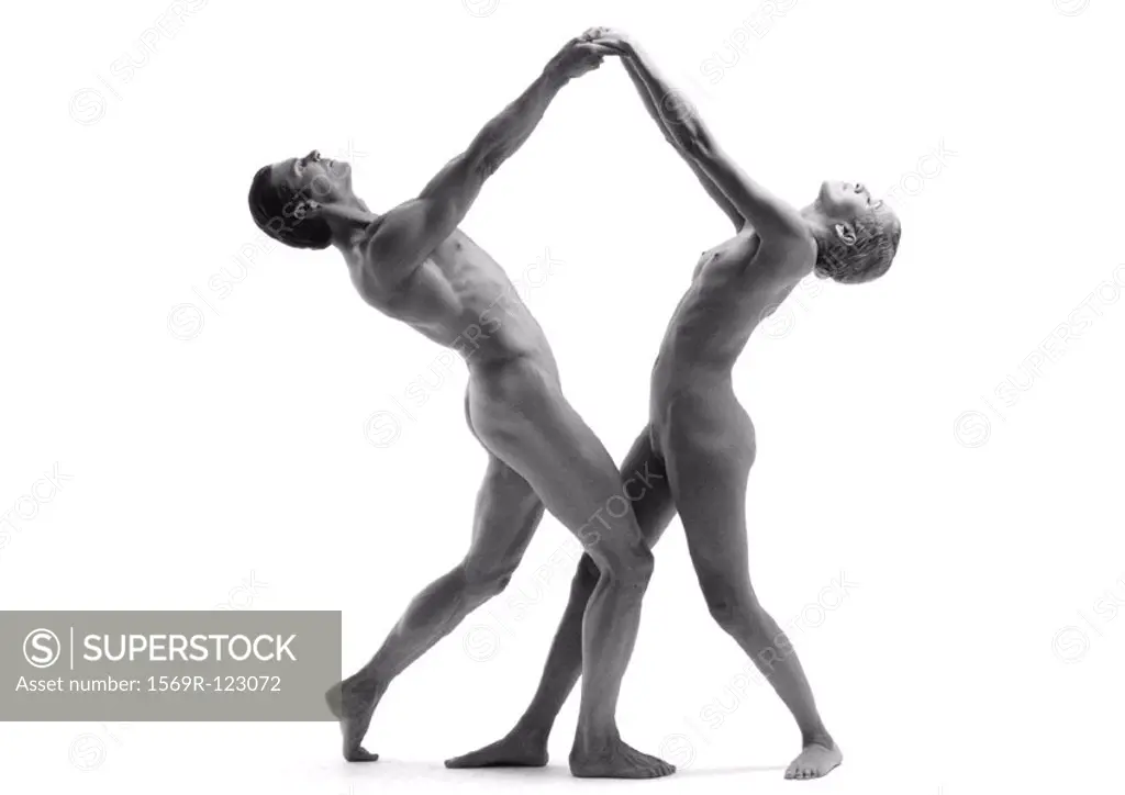 Nude man and woman dancing, side view, b&w