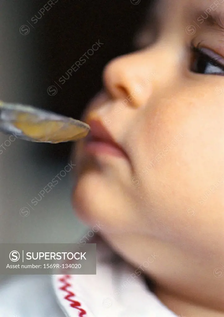 Baby being fed, close-up