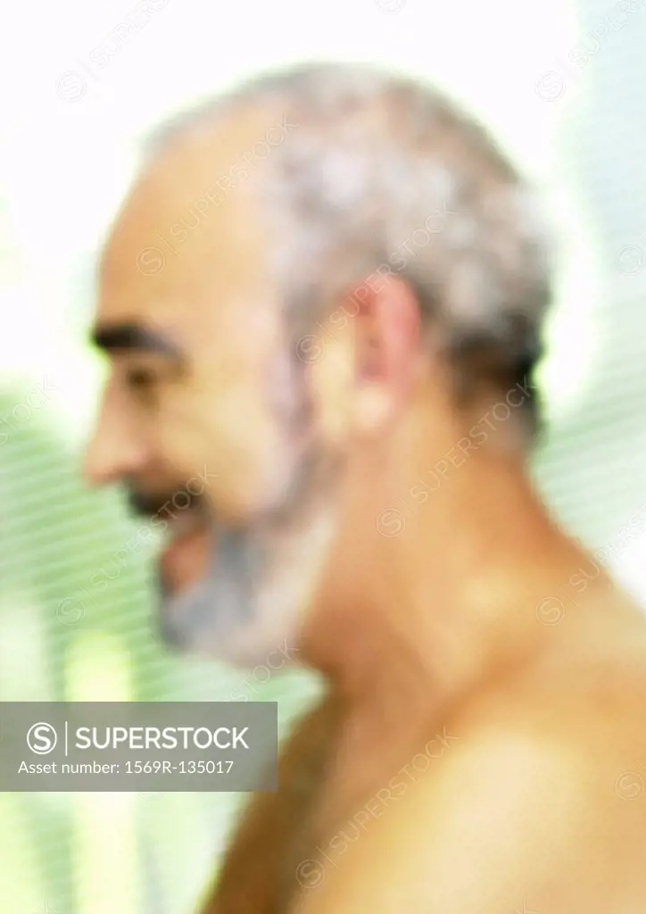 Mature man, side view, close-up, portrait, blurred