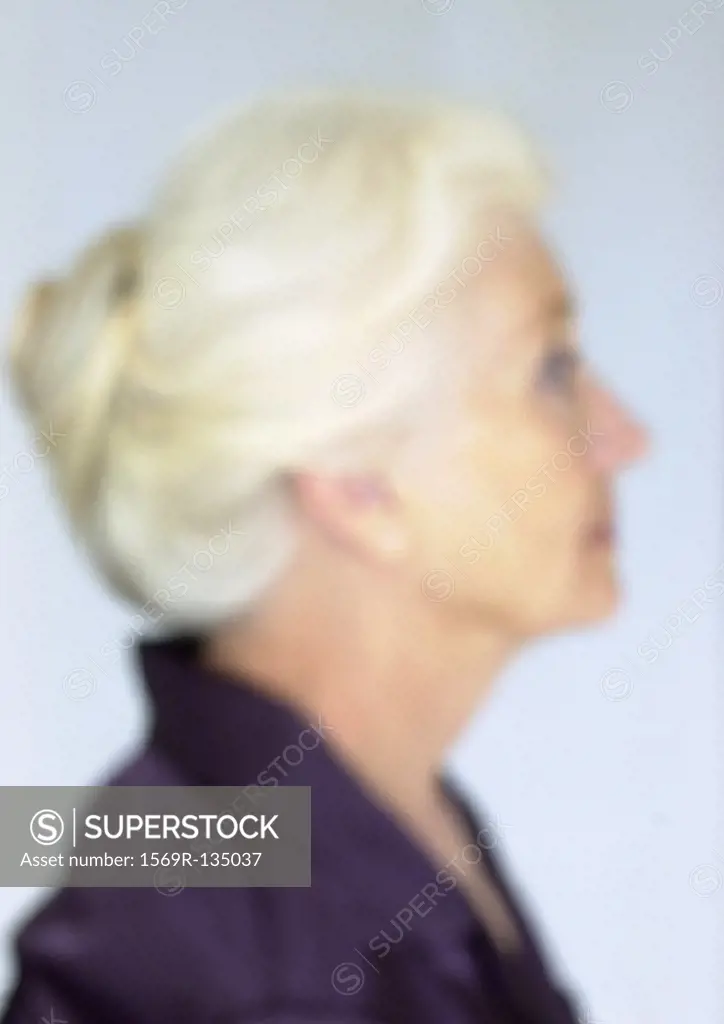 Mature woman, side view, close-up, portrait, blurred