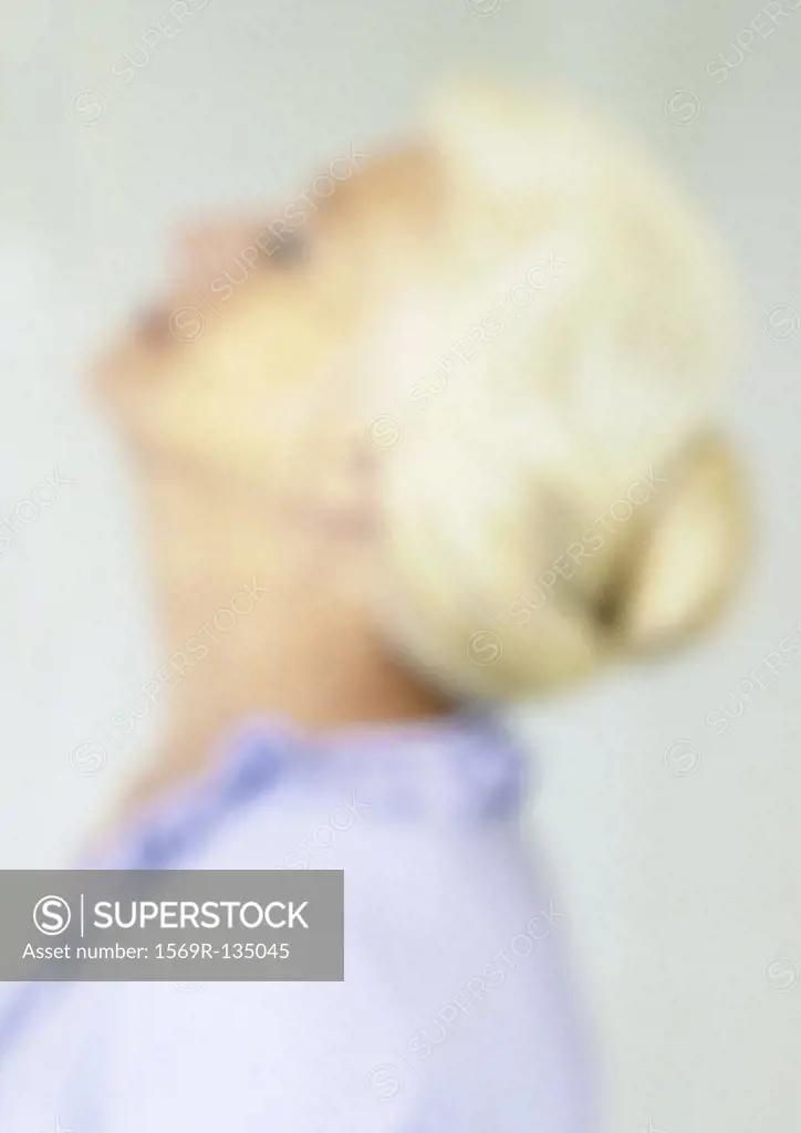 Mature woman with head back, side view, close-up, portrait, blurred