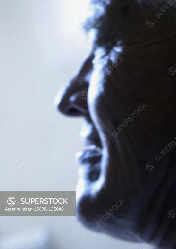 Senior man, side view, close-up, portrait