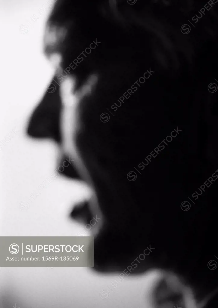 Senior man, close-up, side view, blurred, b&w