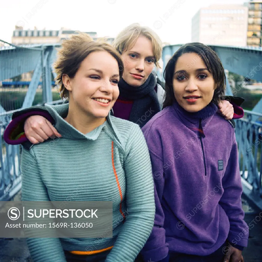 Three young women on bridge