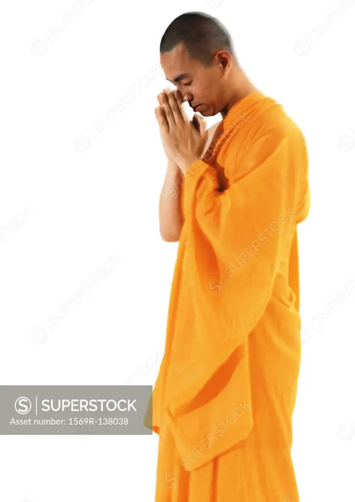 Buddhist monk standing, meditating