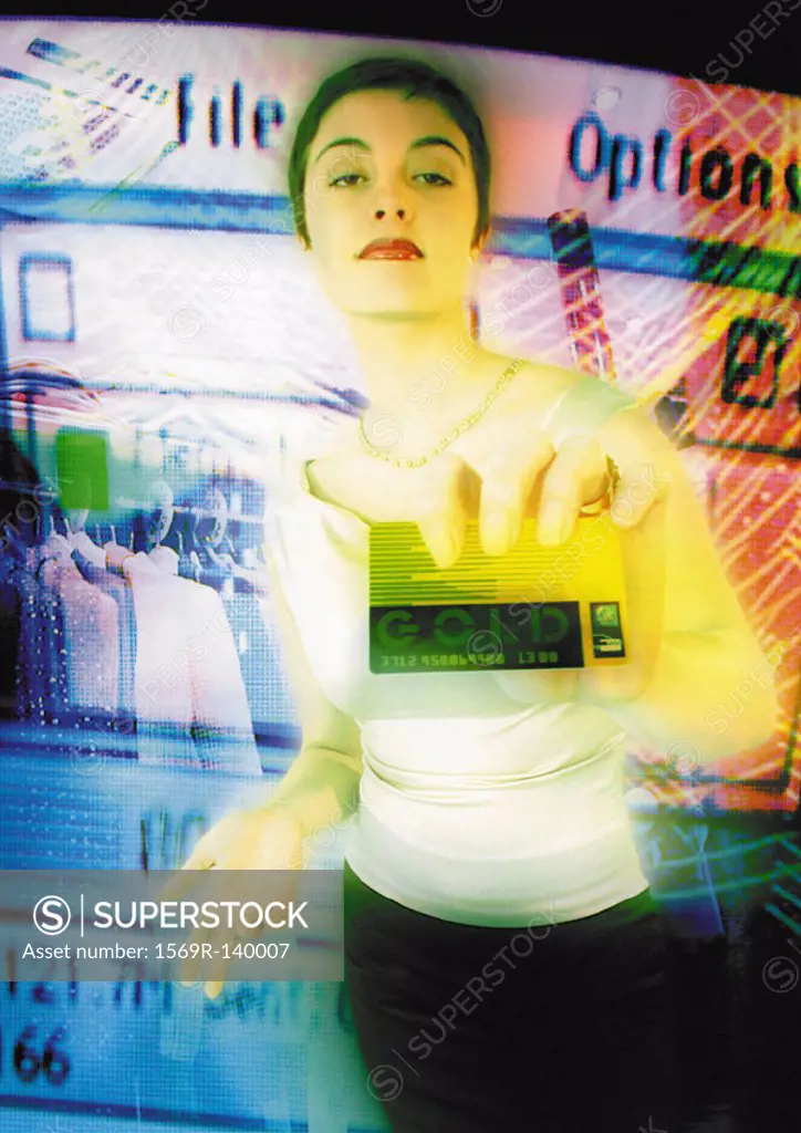 Young woman holding credit card toward camera, digital composite