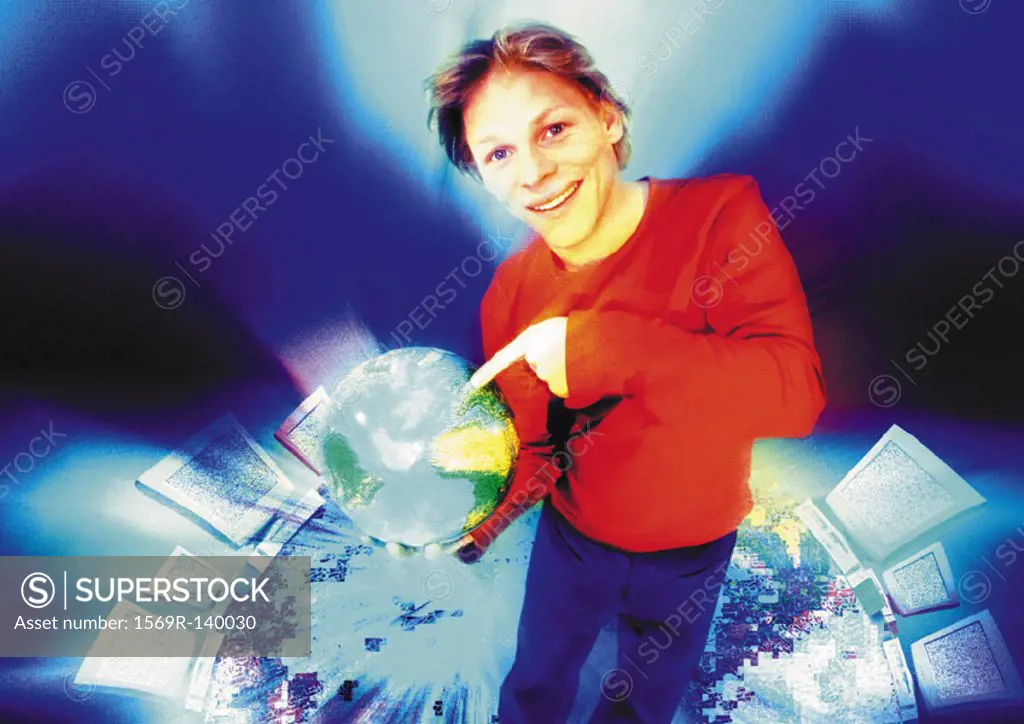 Young man in cyberspace pointing to world globe, digital composite
