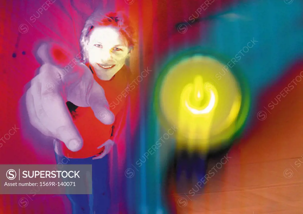 Young man smiling, pointing toward camera, digital composite
