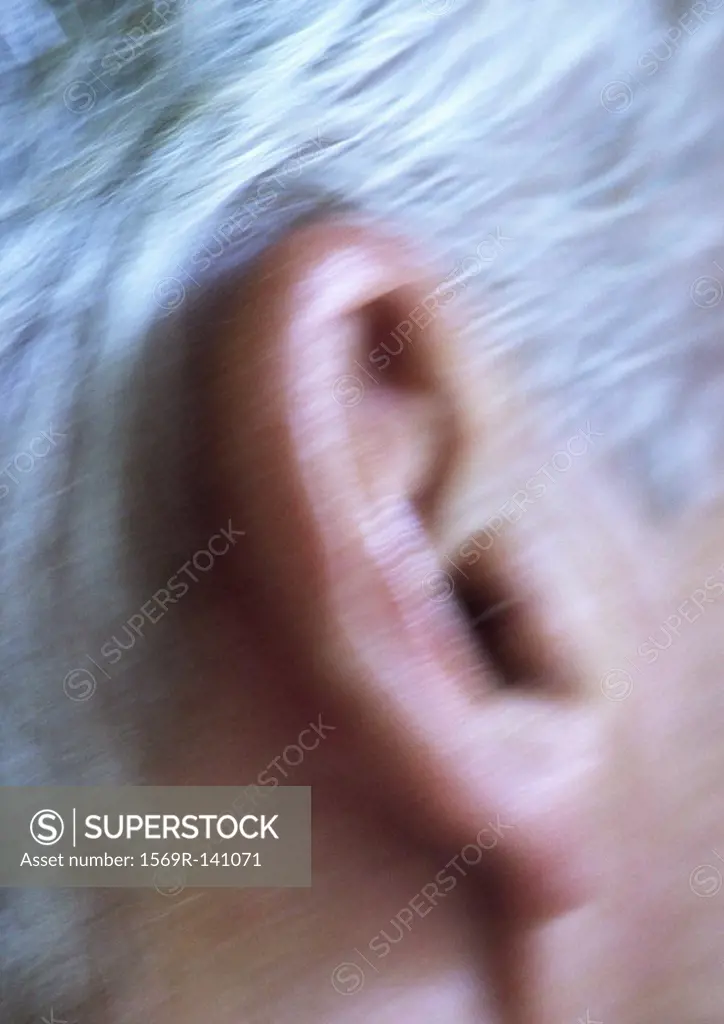 Senior man´s ear, extreme close-up, blurred