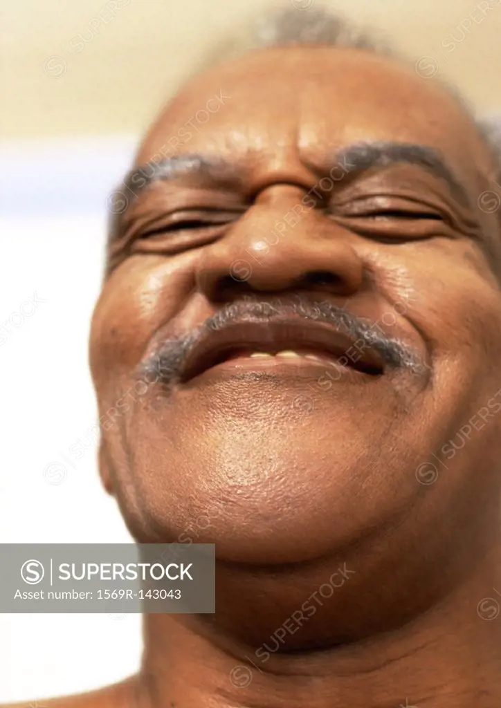 Mature man smiling, portrait, close-up, low angle view