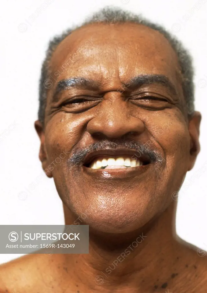 Mature man smiling, portrait, close-up