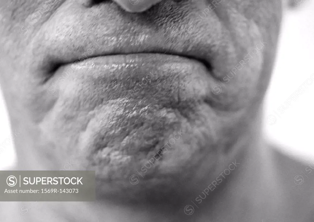 Mature man´s mouth and chin, extreme close-up, b&w