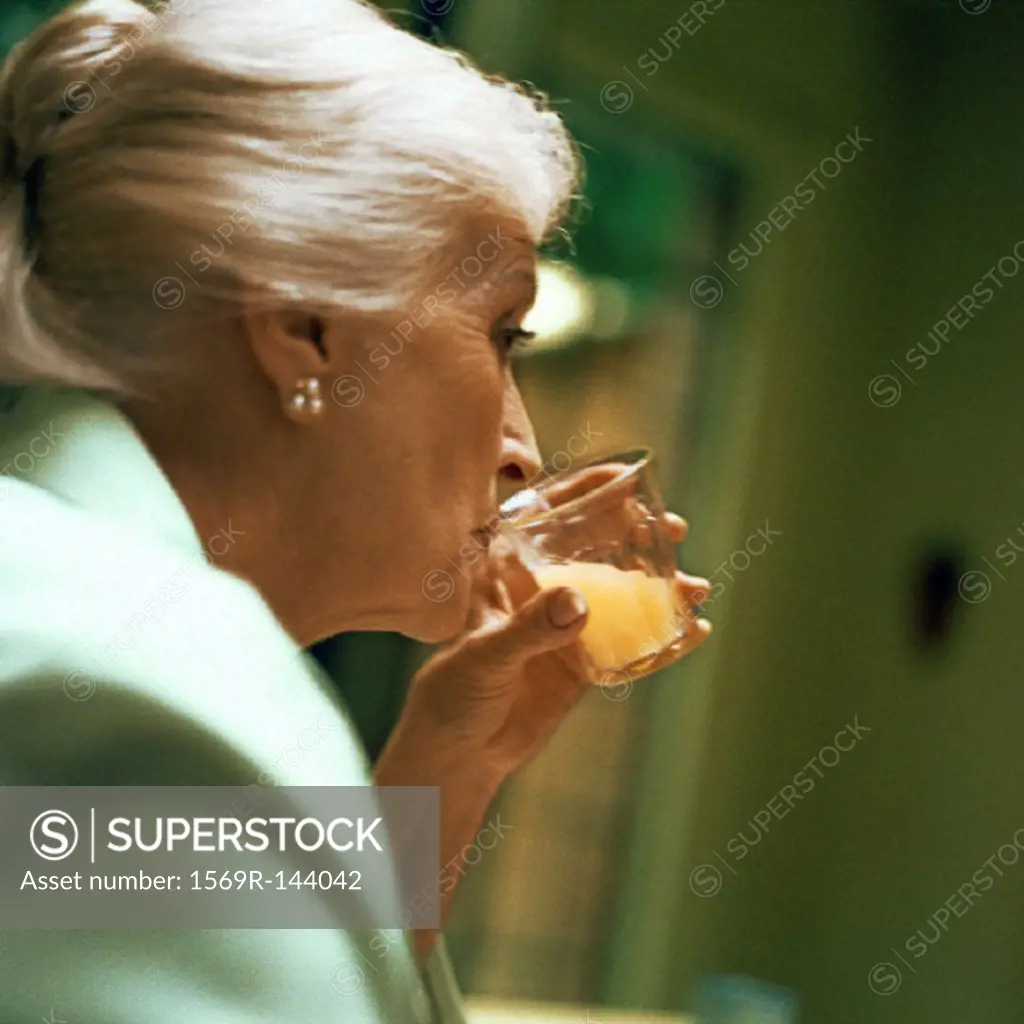 Mature woman drinking, close-up