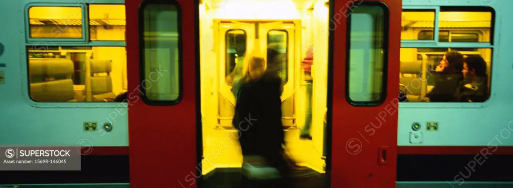 People getting off of subway train