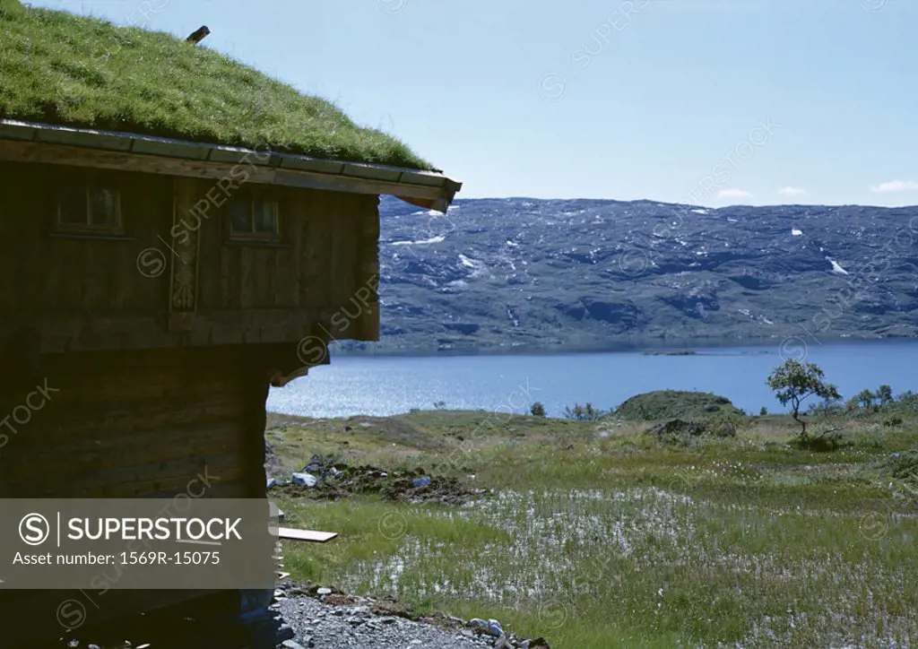 Norway, grass-roofed cabin near water