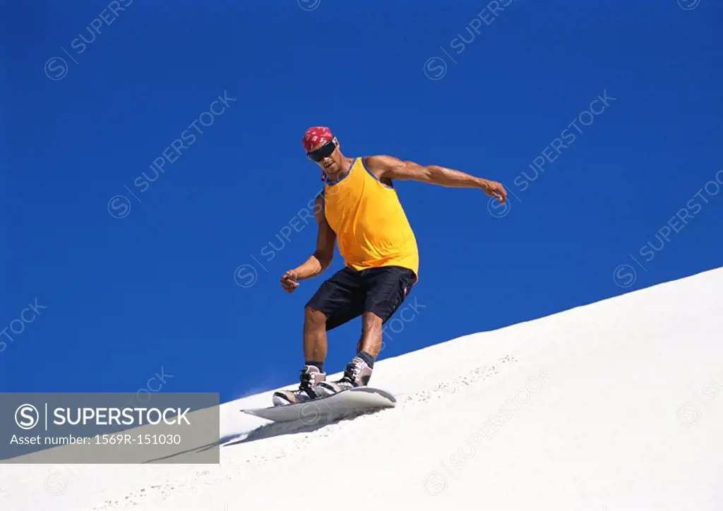 Man snowboarding, low angle view