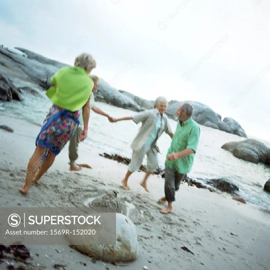 Mature group playing on beach