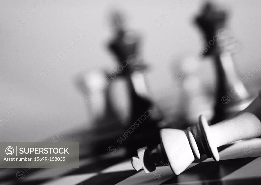 Chess pieces on chessboard, b&w