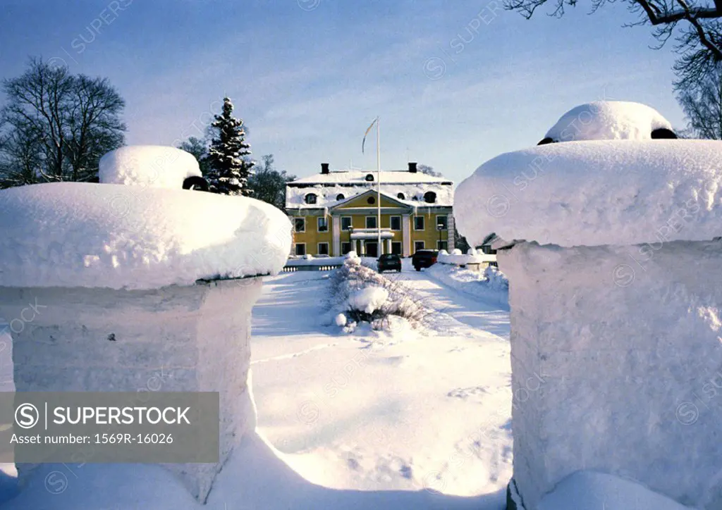 Sweden, mansion in snow in distance