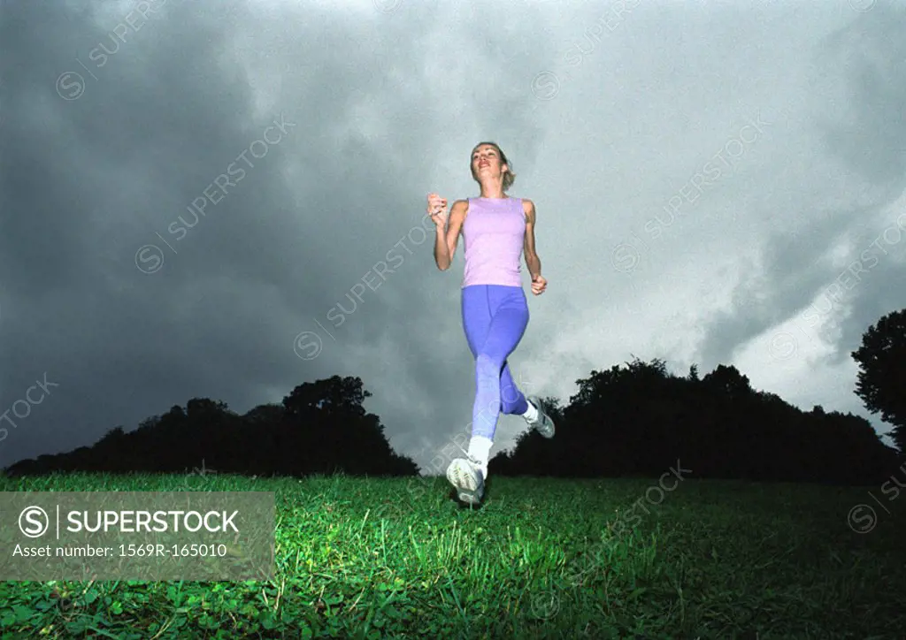 Woman running, low angle view