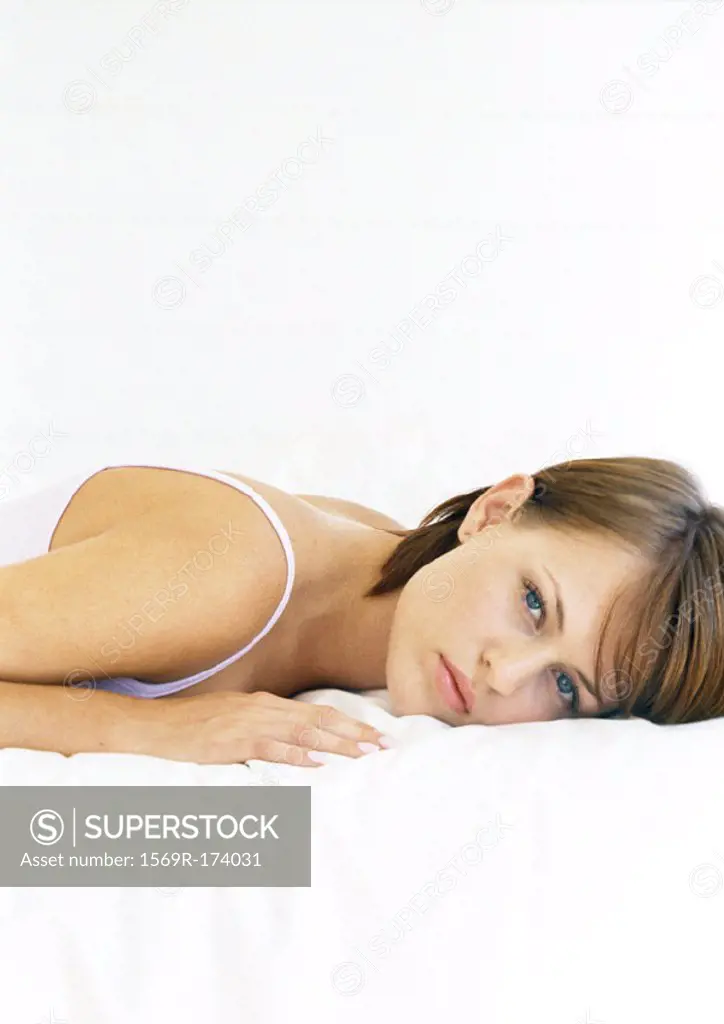 Woman lying on stomach, portrait, close-up